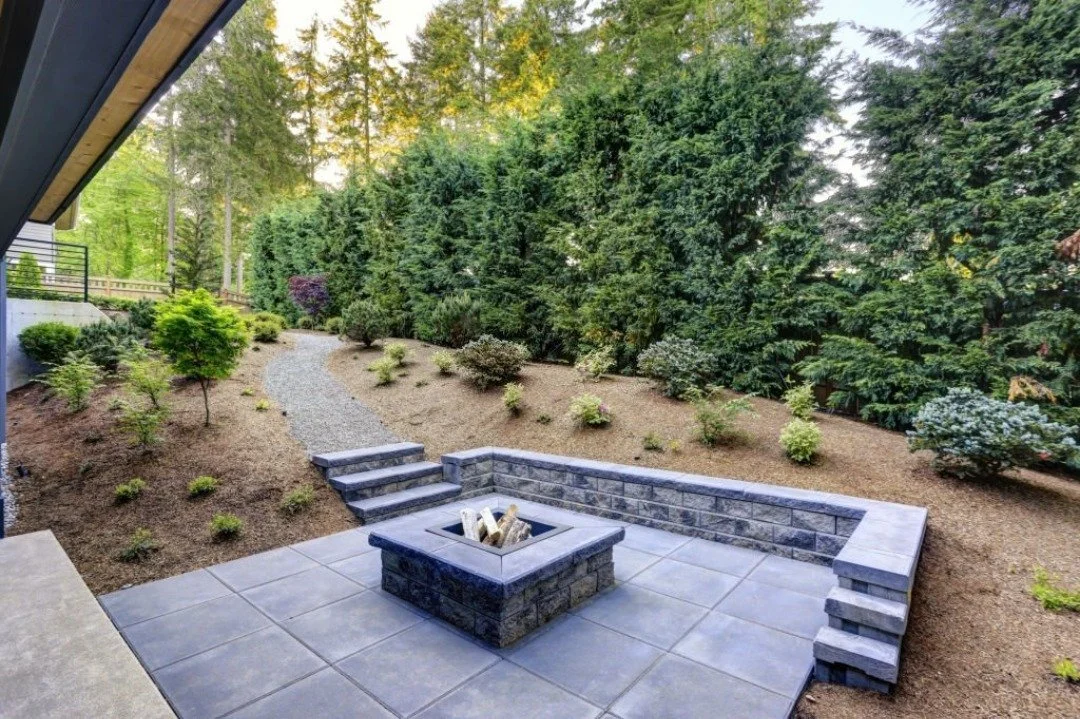 A finished firepit and outdoor living space.