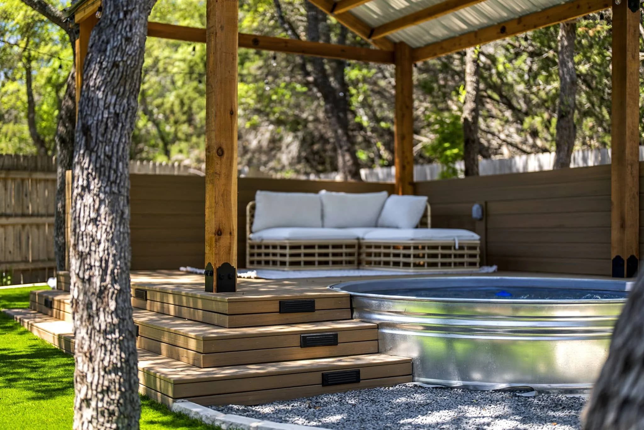 Low-maintenance backyard renovation with artificial turf and custom putting green — Southern Love