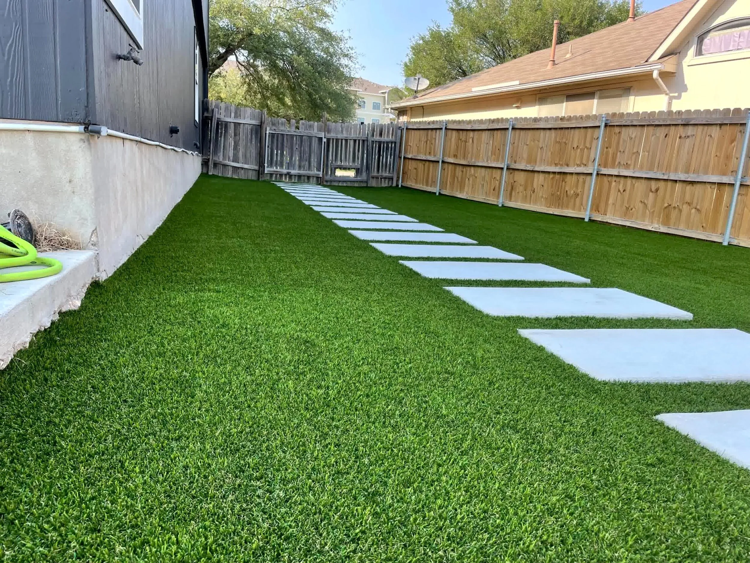 Artificial turf provides year-round beauty with limited maintenance.