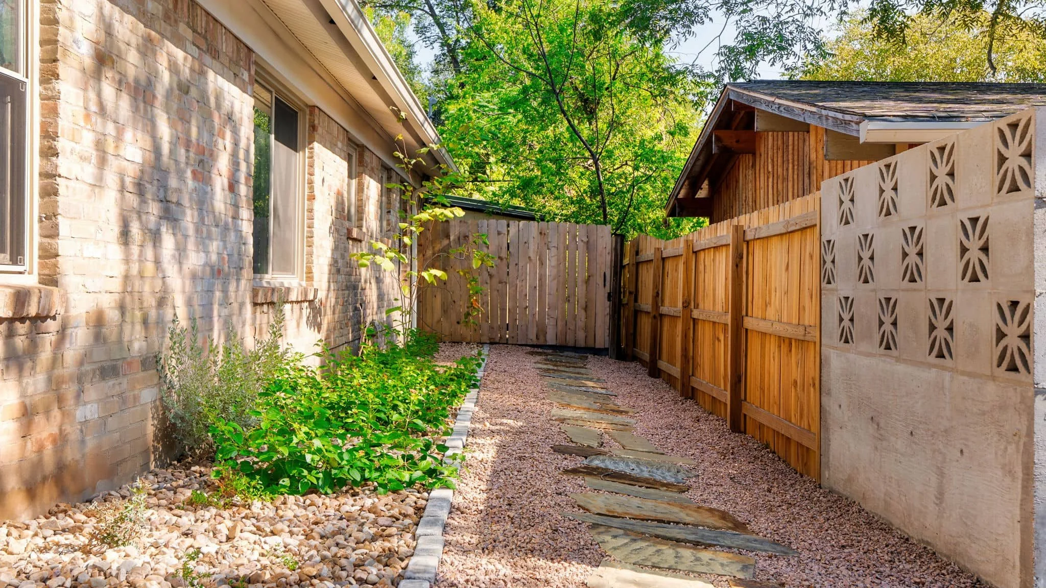 Low-maintenance front yard makeover with textured gravel and organized landscaping — Southern Love