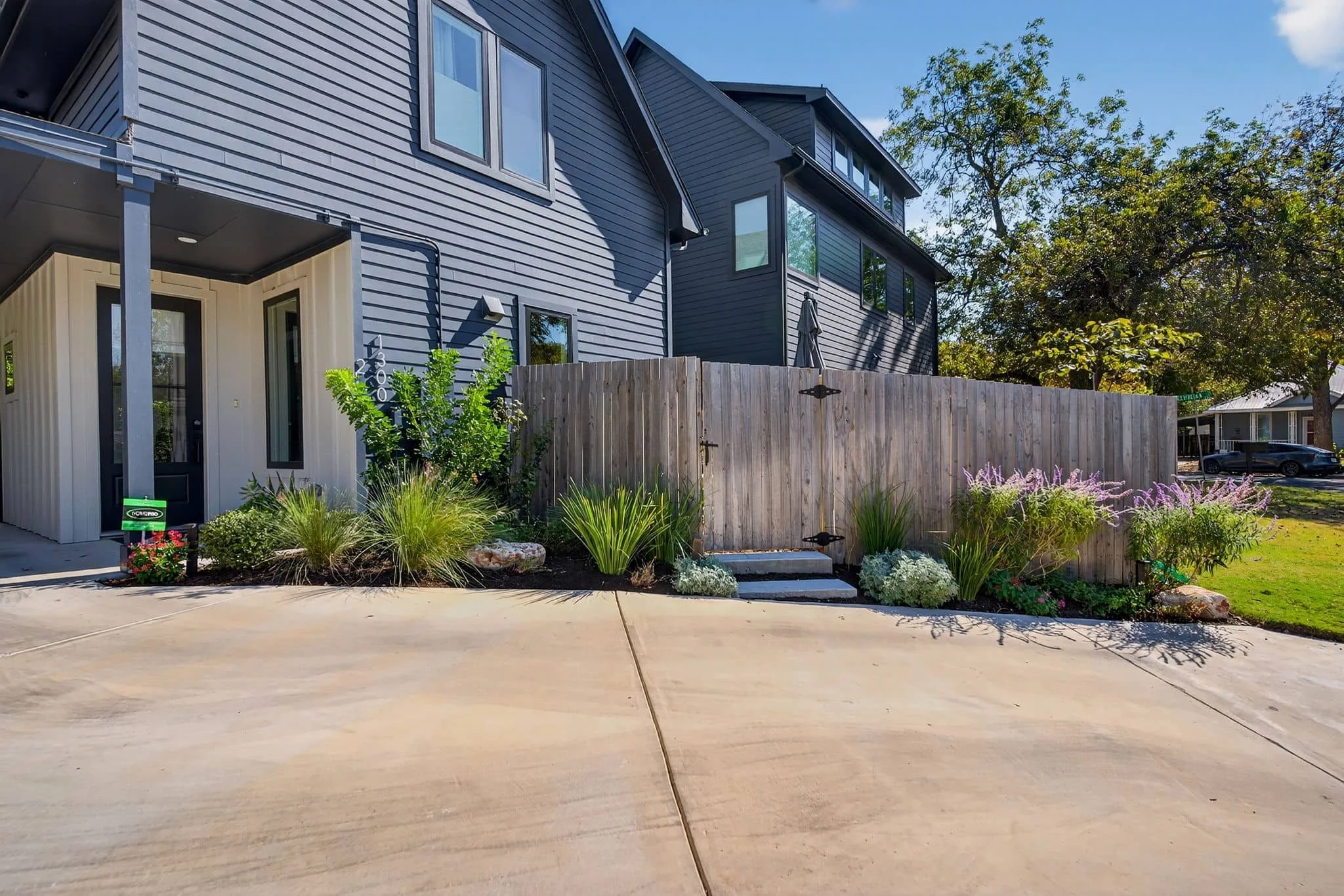 Calm and inviting outdoor landscape with decking, gravel, and layered plantings — Southern Love