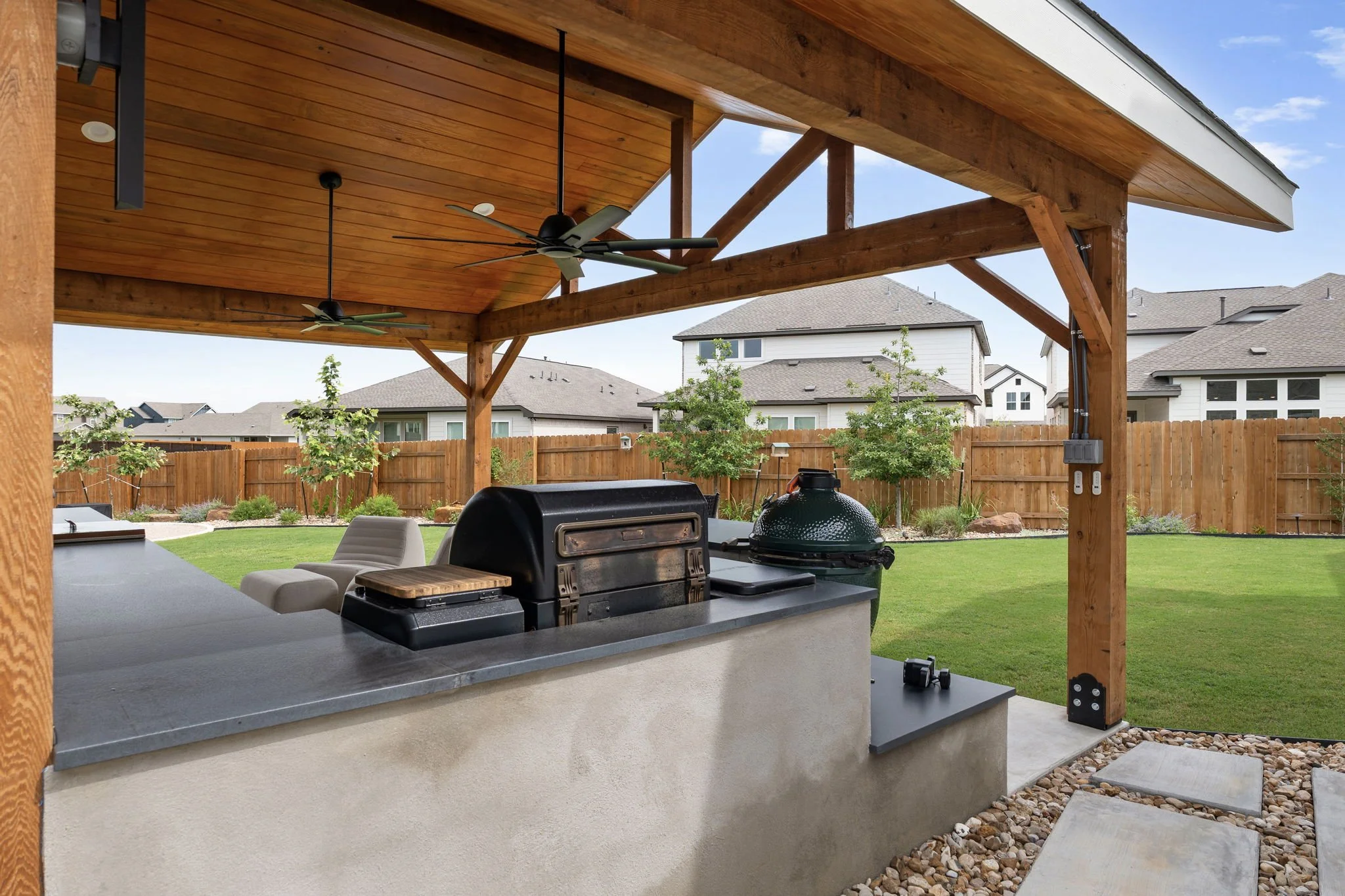 Built-in grill, kamado smoker, and stained tongue-and-groove ceiling