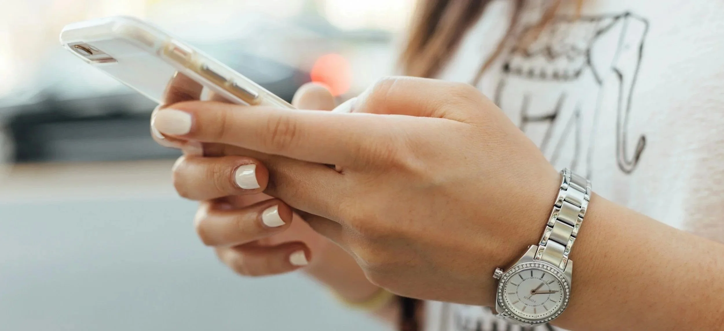 a teen girl holding a mobile device