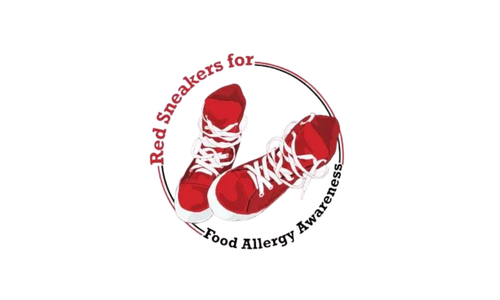 Red sneakers with white laces inside a red circle on a black background.