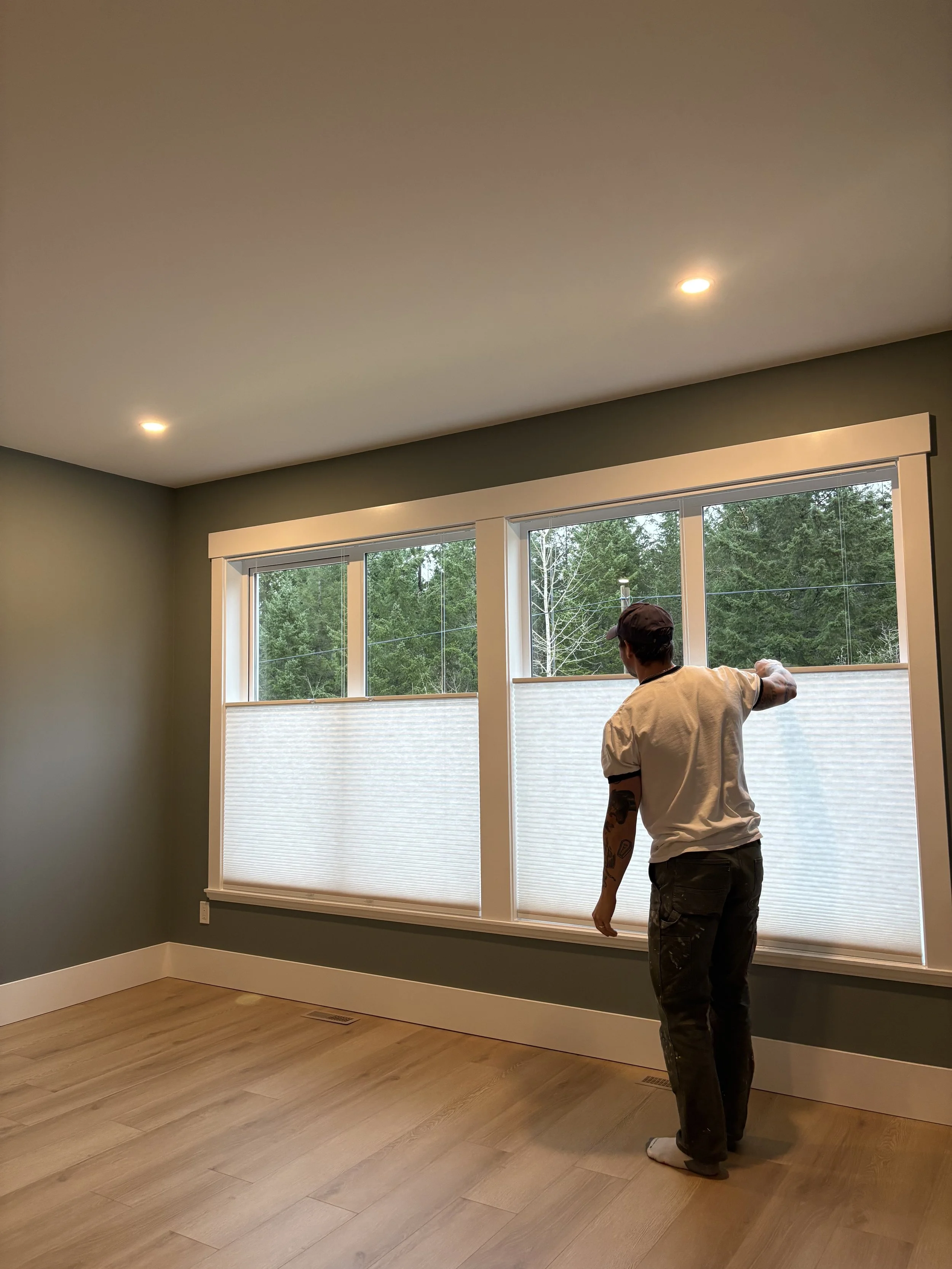 A painter preparing a room for painting with thought and carefulness