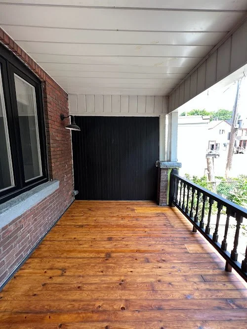 Exterior wood refinishing service revitalizing weathered backyard deck