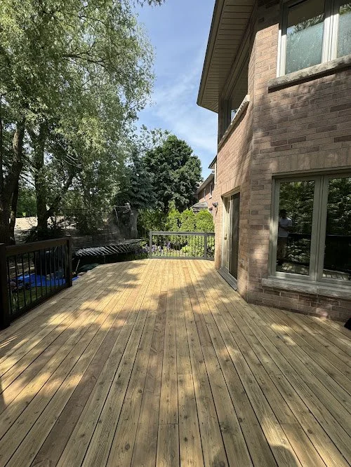 Pressure treated backyard deck refinishing in the Richmond Hill including sanding, sealing, and wood replacement using premium oil stain and sealer
