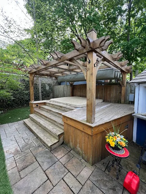 Before and after wood pergola and hot tub restoration completed by Proper Finish exterior wood specialists
