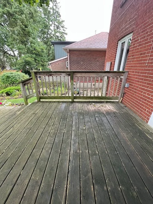 Residential wood refinishing service restoring faded deck boards to original beauty