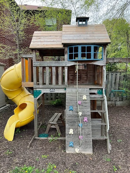 Clean, restored playground surface after professional exterior wood washing