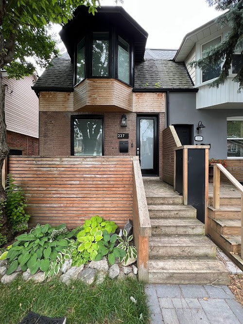 Wood railing sanding and staining on residential porch