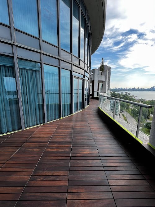 Ipe Hardwood rooftop balcony deck maintenance in Toronto maintaining hardwood with specialized cleaning and hardwood oil stains