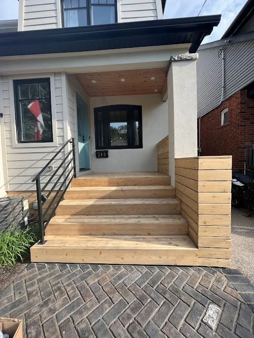 Residential softwood deck maintenance in Toronto including cleaning and moisture protection. New wooden steps and porch.