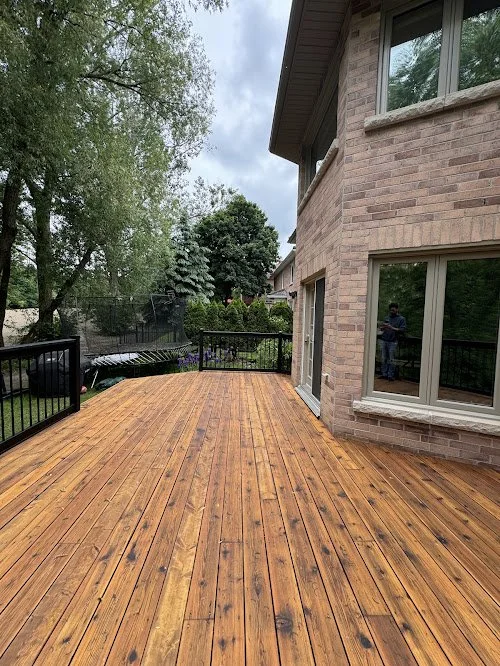 Pressure treated backyard deck refinishing in Aurora and York Region including sanding, sealing, and wood replacement using premium oil stain and sealer