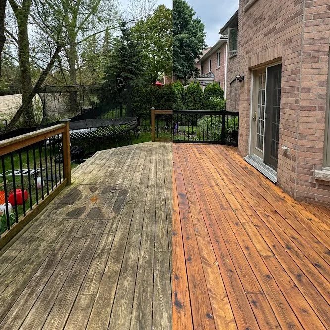 Exterior wood sanding and repair work on aging backyard deck in Toronto home