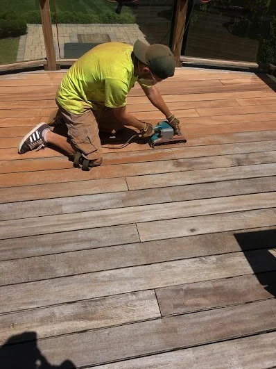 Exterior wood deck refinishing with professional sanding and oil staining