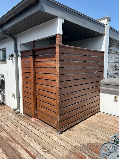 Softwood backyard deck refinishing in Toronto correcting surface damage through sanding and staining