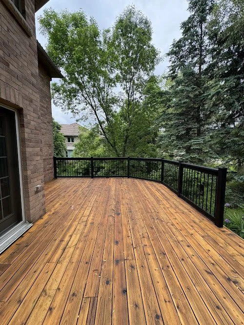 Pressure treated backyard deck refinishing in Scarborough featuring new board installation, washing, sanding and staining using oil based stain and sealer