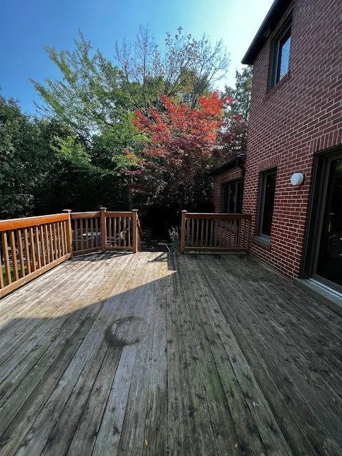 Softwood deck refinishing in Toronto showcasing detailed sanding and even stain coverage