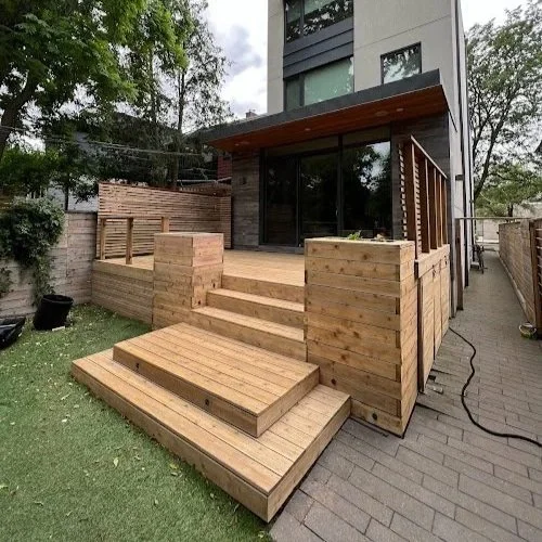 Pressure treated deck refinishing in Toronto restoring weathered boards with sanding and staining