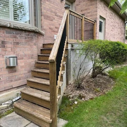 Cedar fence and deck refinishing in Toronto restoring faded wood through sanding and staining using oil stain