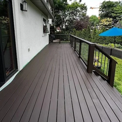 Pressure treated deck refinishing in Toronto featuring washing, sanding, staining, and sealing by Proper Finish