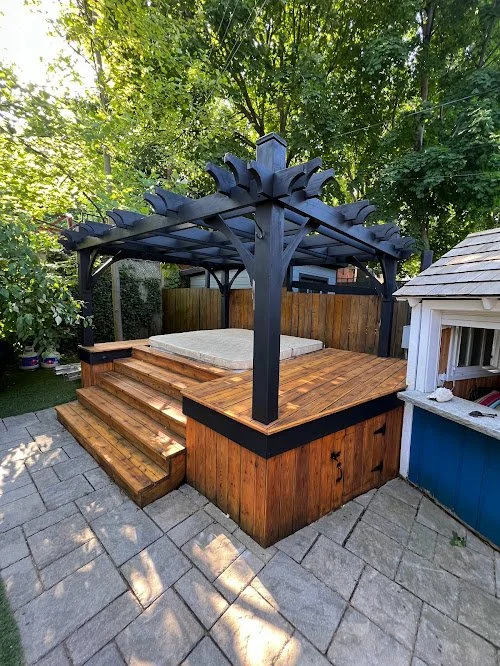 Residential pergola and hot tub refinishing project showing professional sanding and staining by Proper Finish in Toronto