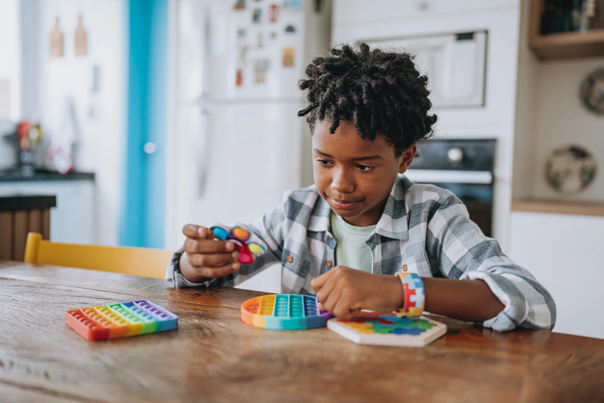 Child using fidget toys and sensory activities to support focus and engagement