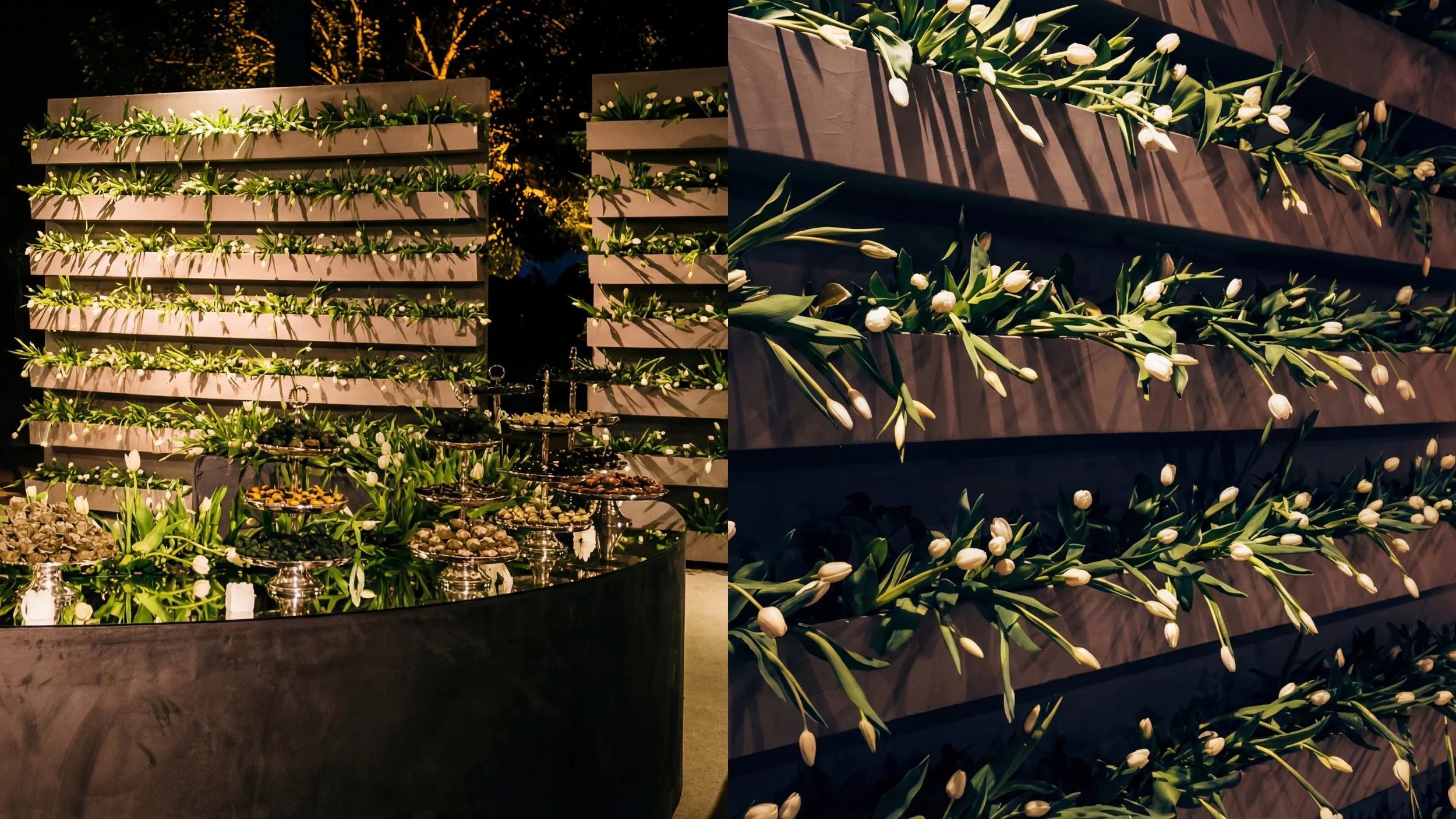 Decoração com flores brancas e folhas verdes, dispostas em painéis de madeira e suportes de prata, em evento noturno.