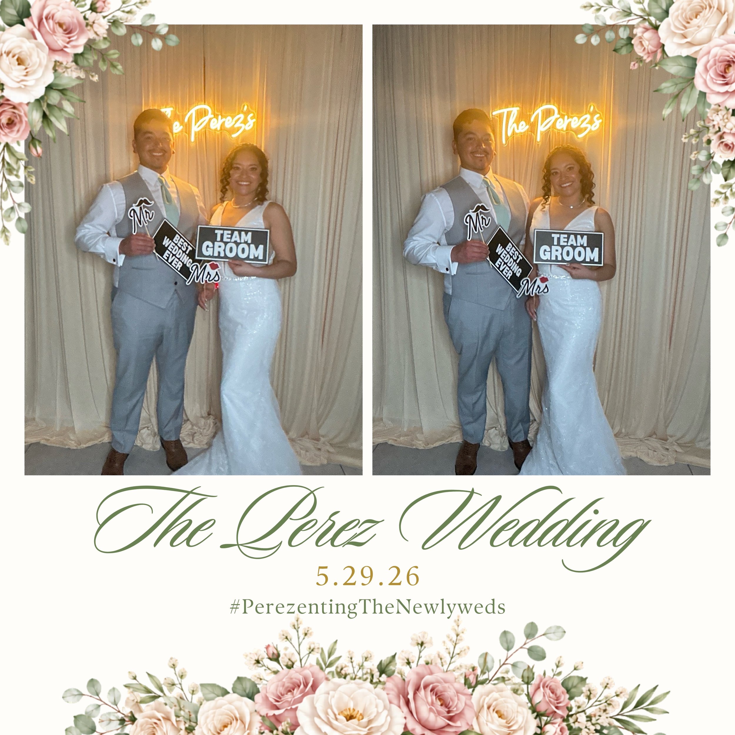 Image of a wedding celebration with a couple holding signs reading 'Mr' and 'Mrs' and a backdrop with e luminous 'The Perez's' sign, surrounded by pink and white flowers and green foliage, with a date of 5.29.26.