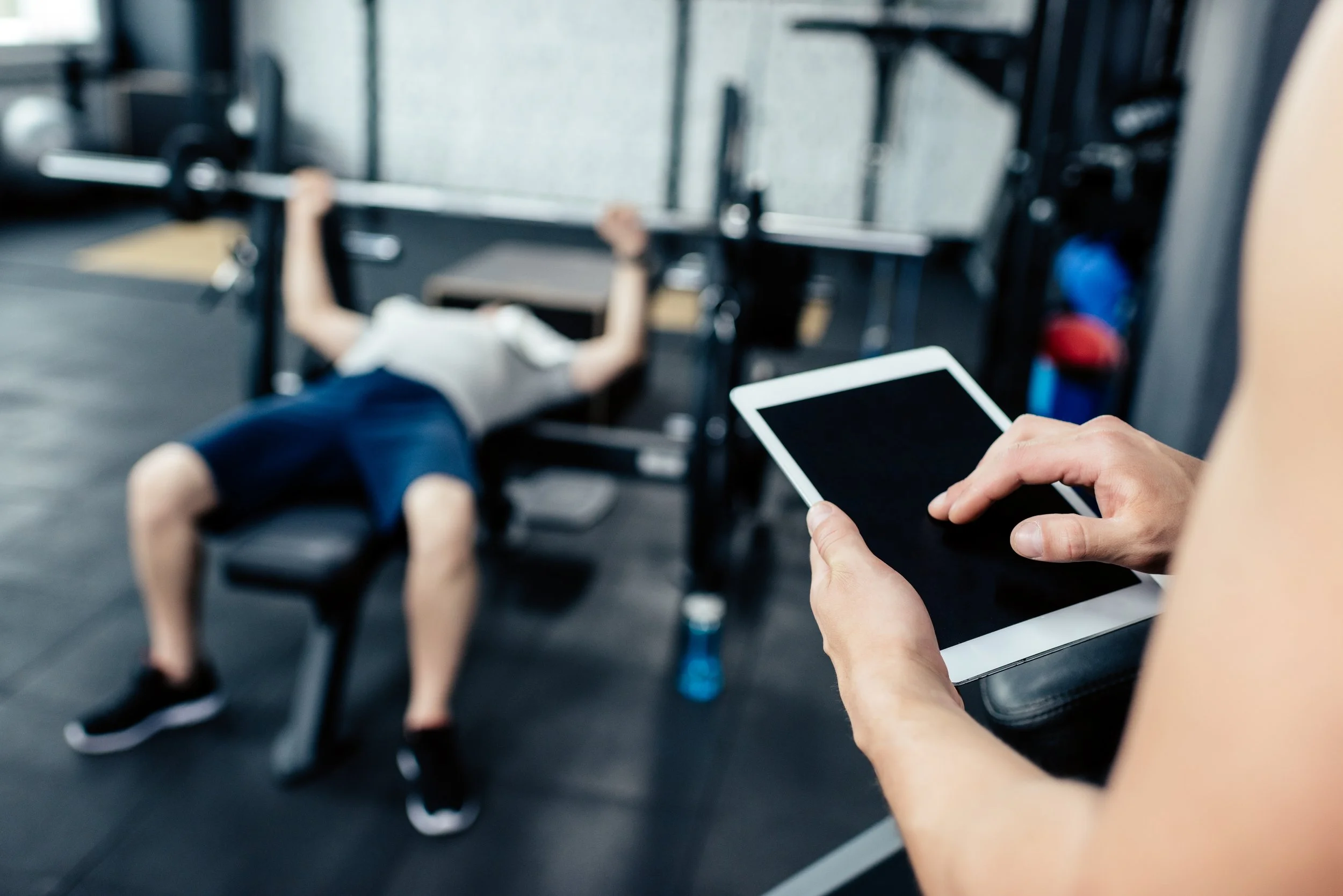 cropped-view-of-trainer-using-digital-tablet-while-2026-03-12-23-56-48-utc.jpg