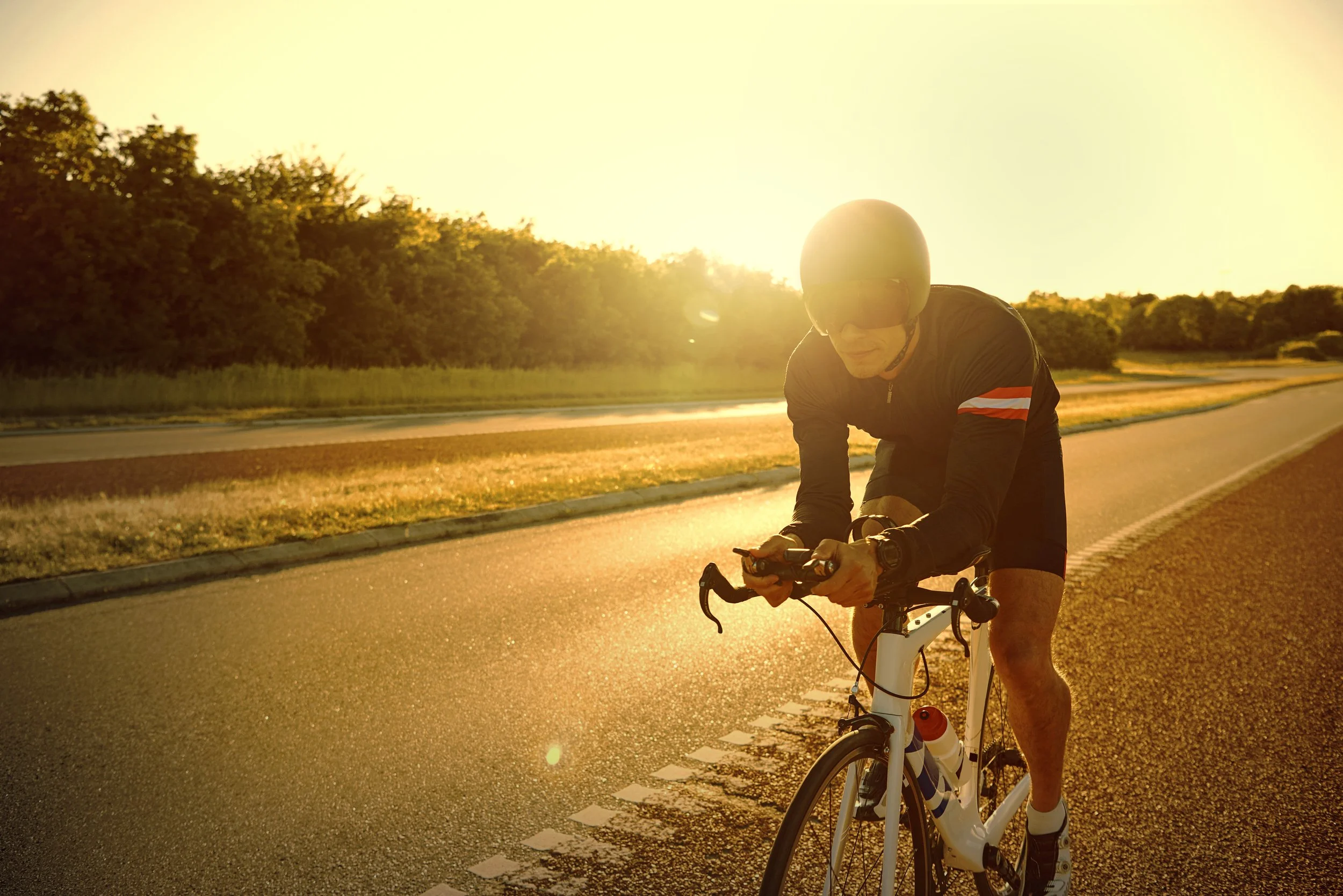 man-cycling-on-a-quiet-road-at-sunrise-2026-03-09-06-05-01-utc.jpg