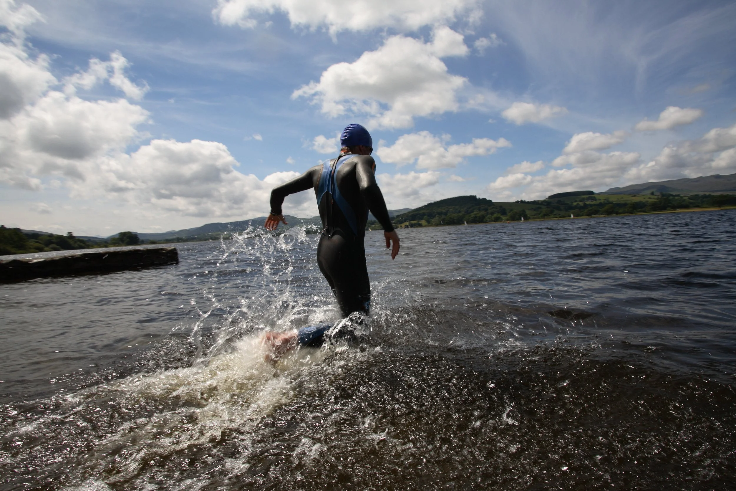 adult-running-into-water-on-a-sunny-day-2026-01-05-23-31-49-utc.jpg