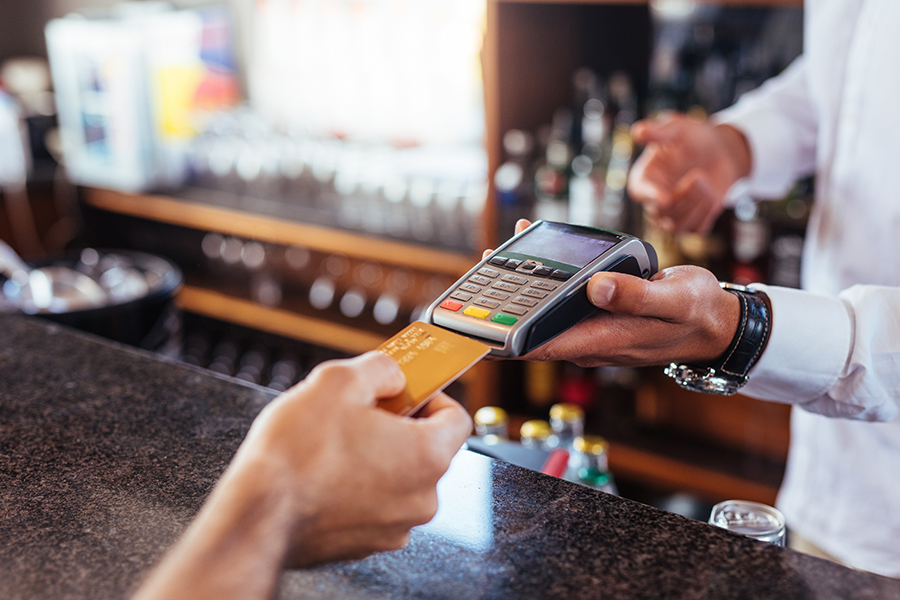Credit card payment device being used at a bar