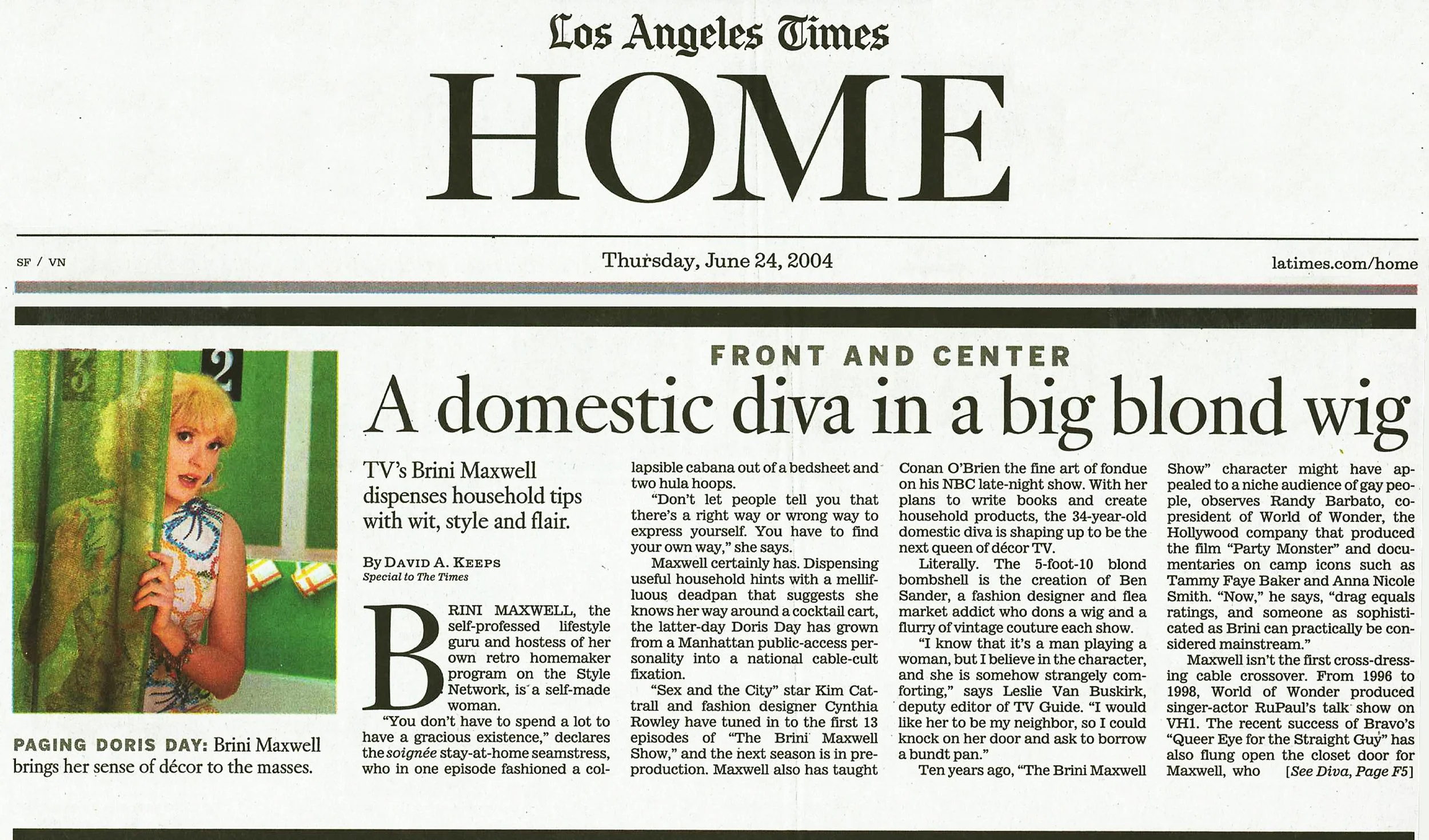 A newspaper page from the Los Angeles Times Home section dated Thursday, June 24, 2004, featuring an article titled 'A domestic diva in a big blonde wig' with an image of Brini Maxwell wearing a 1960's floral print sheath dress.
