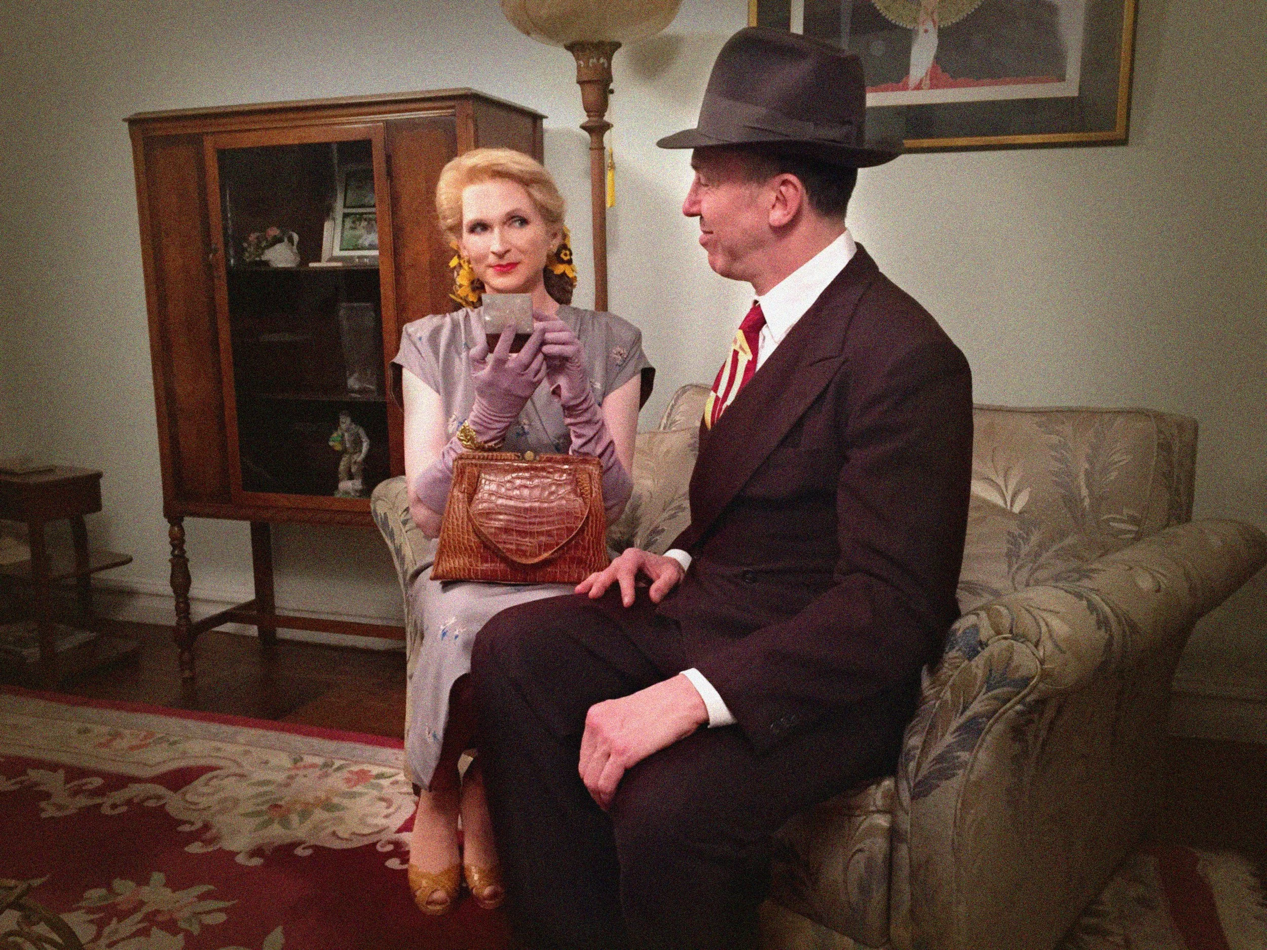 Brini Maxwell and Daniel Nardicio wearing 1940's clothes in a 1940's styled interior.