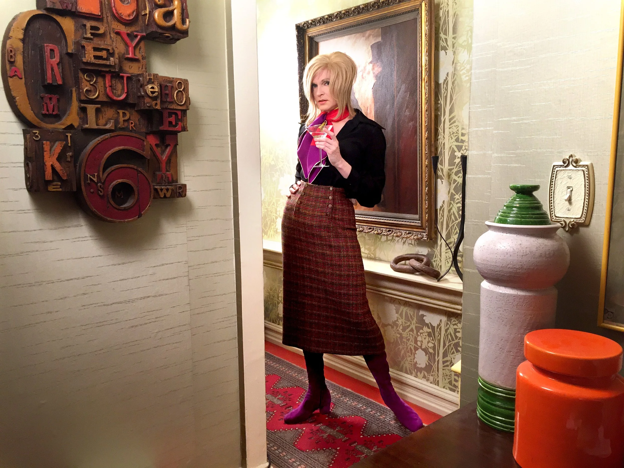 Brini Maxwell in an early 1970's midi skirt in a dramatic Hollywood Regency style setting.