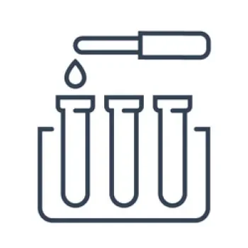 A dropper with a liquid dropping into test tubes inside a rack.