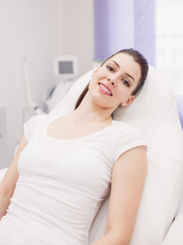 Woman lying in a hospital bed.