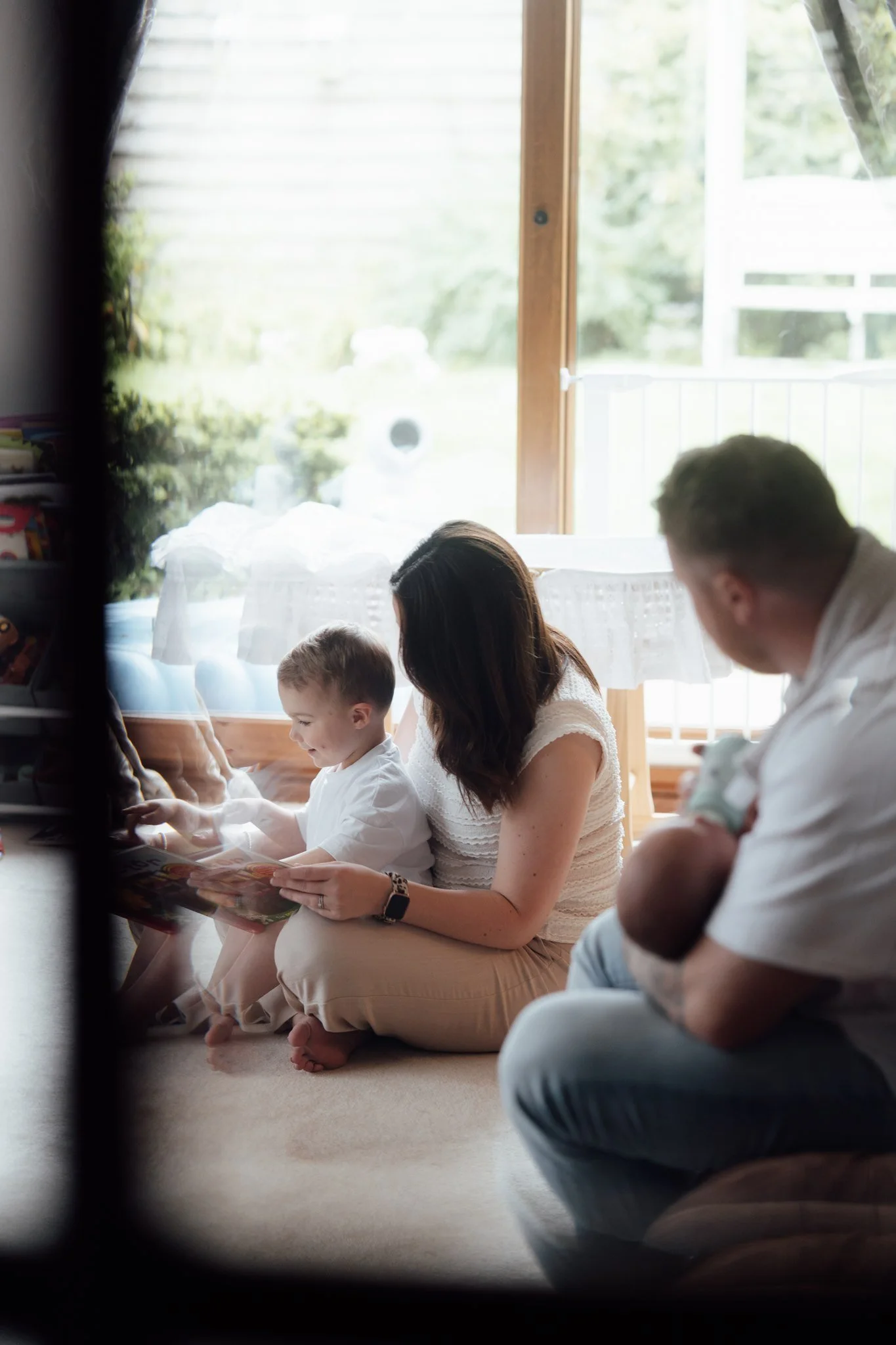 at home family photoshoot with toddler and newborn in fife Scotland,natural and candid family photography at home, dog friendly