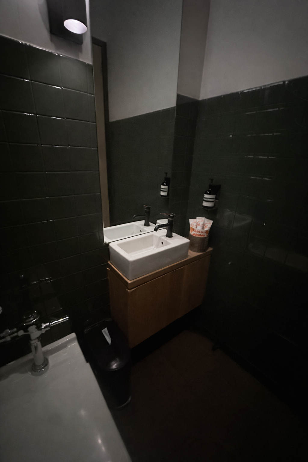 Tampons on Counter in Dark Bathroom