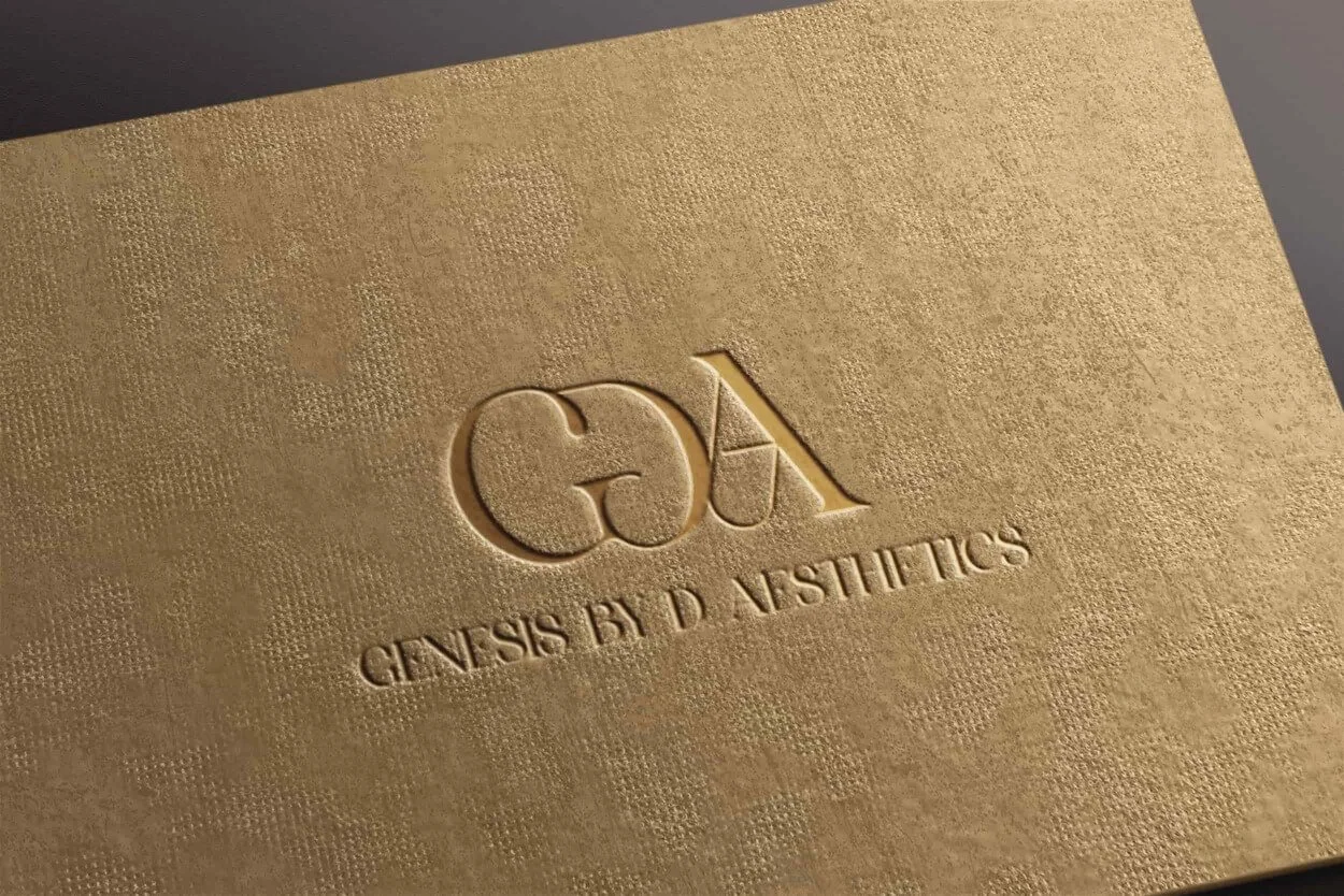 Logo with the letters 'GA' and the text 'Genesis by D Aesthetics' on a light textured background.