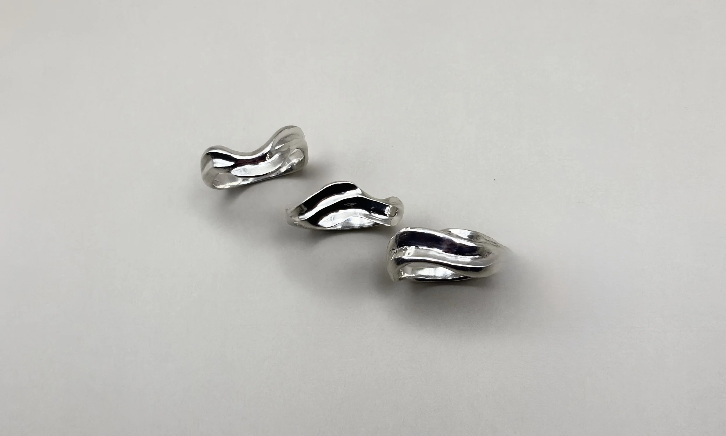 Three beach and coastal inspired sterling sliver rings.