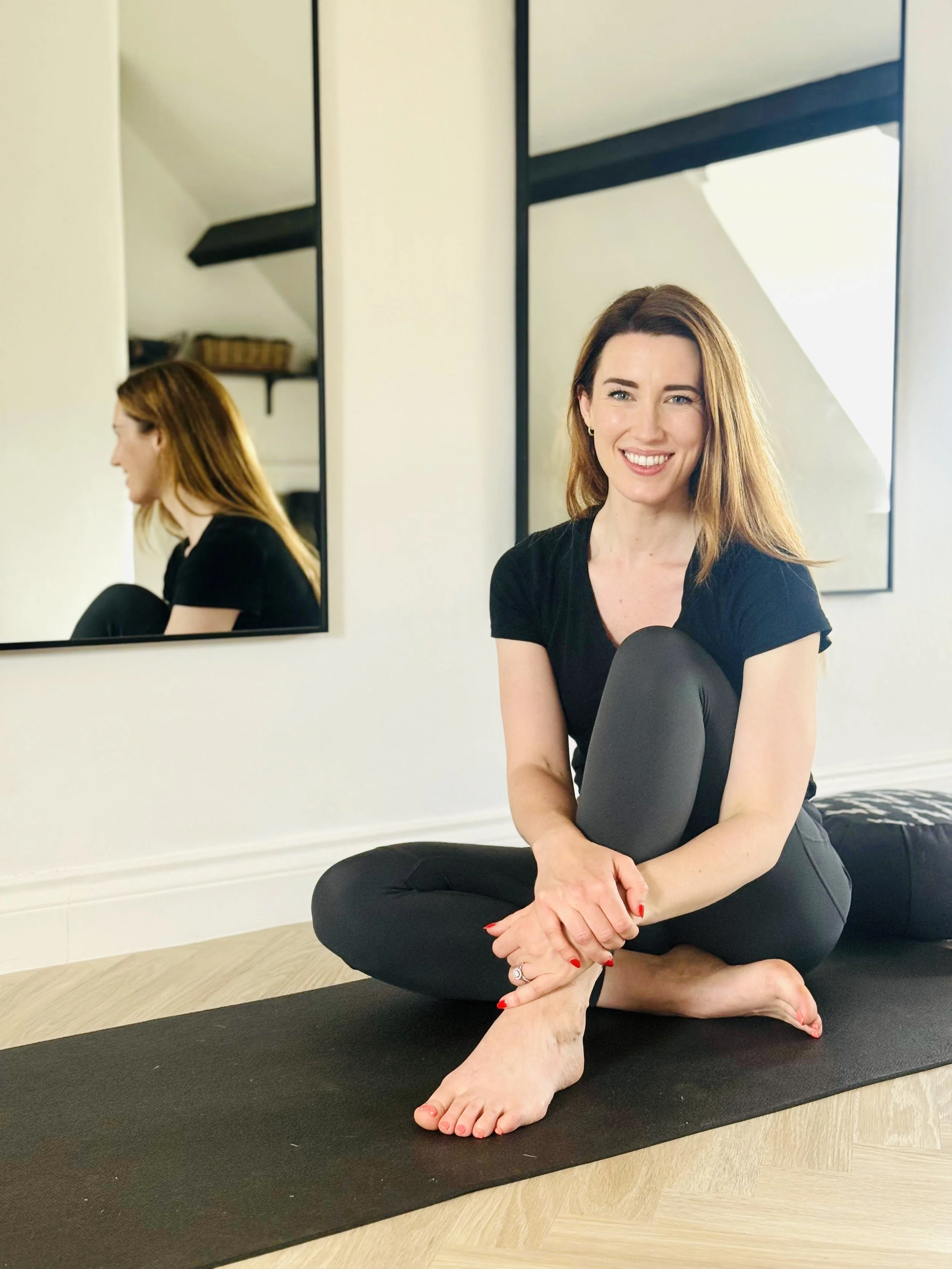 Yoga teacher leading a calm, supportive class at Forma Movement in the North Cotswolds.