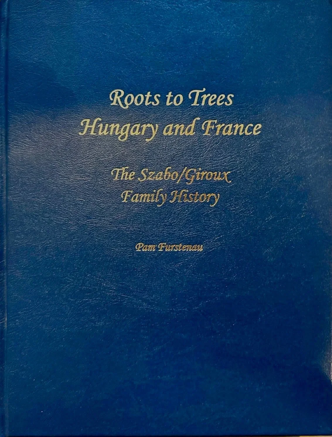A family history book titled 'Roots to Trees: Hungary and France, The Szabo/Giroux Family History' by Sunna before she changed her name legally.