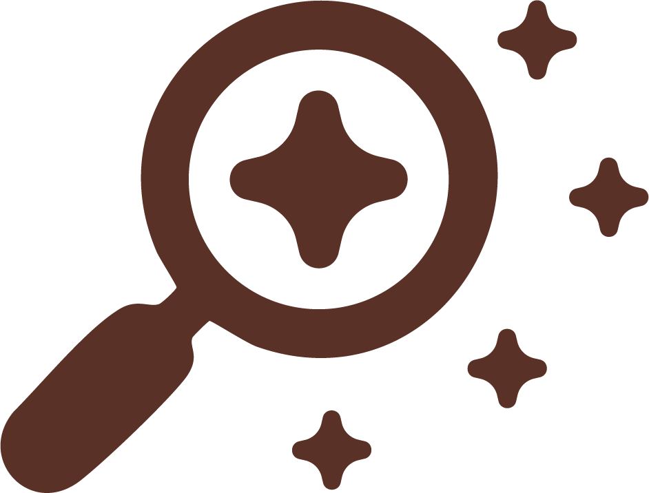 Magnifying glass over a star-shaped cookie with smaller star shapes nearby, all in brown on a black background.