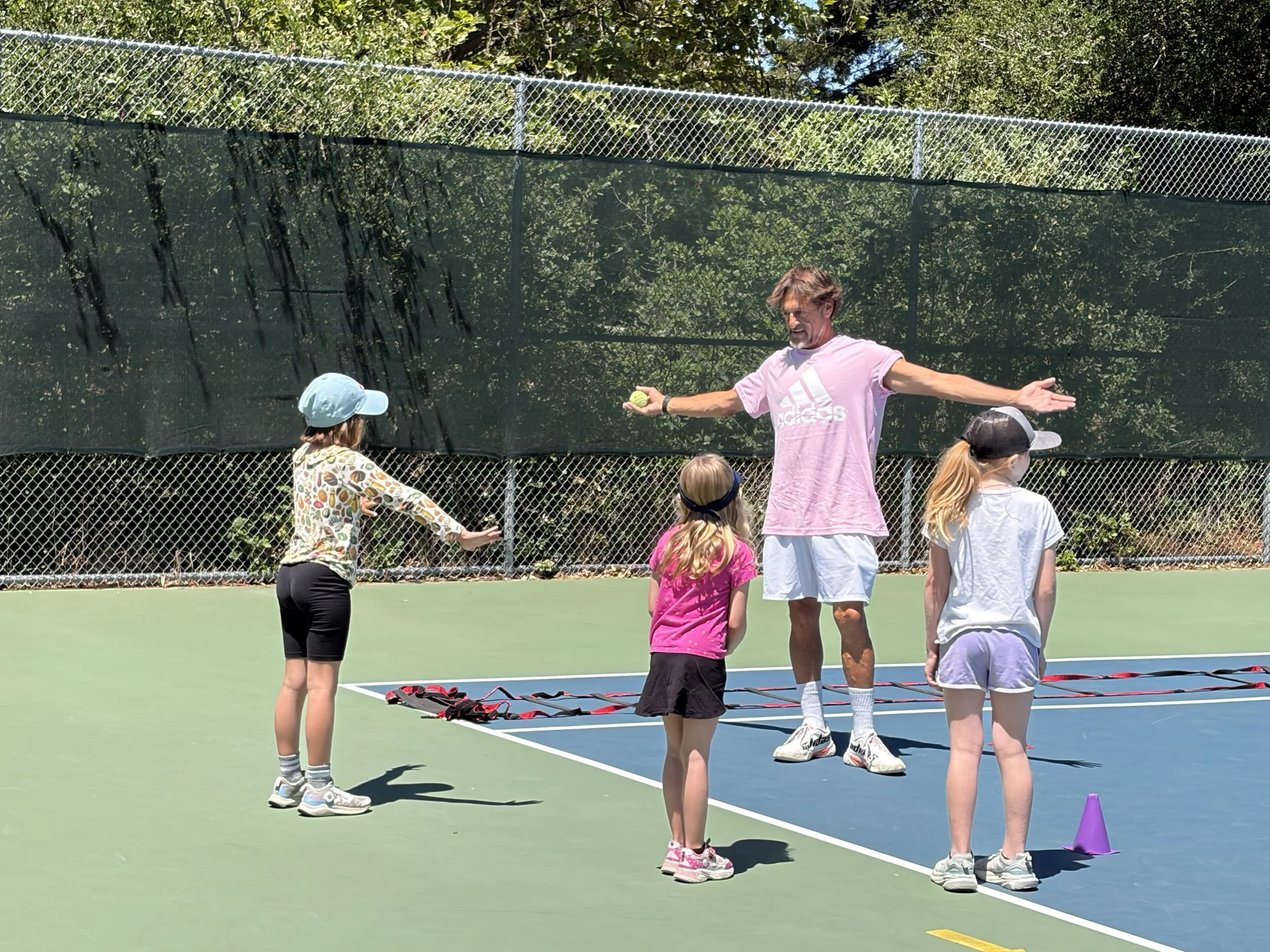 Kids learning tennis at the recent Junior Clinic taught by Sam Levy at Ragle Ranch Park