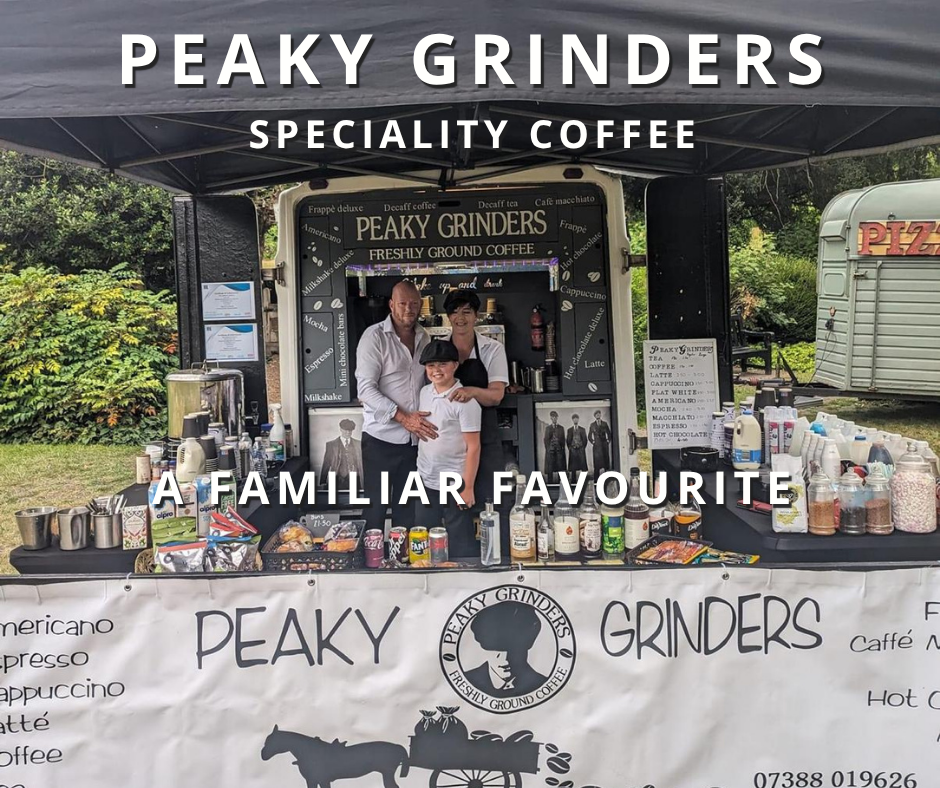 A coffee stall named 'Peaky Grinders Specialty Coffee' with three people posing in front. The stall displays various coffee options and ingredients, with a menu board on the side. A canopy covers the stall, and trees are visible in the background.