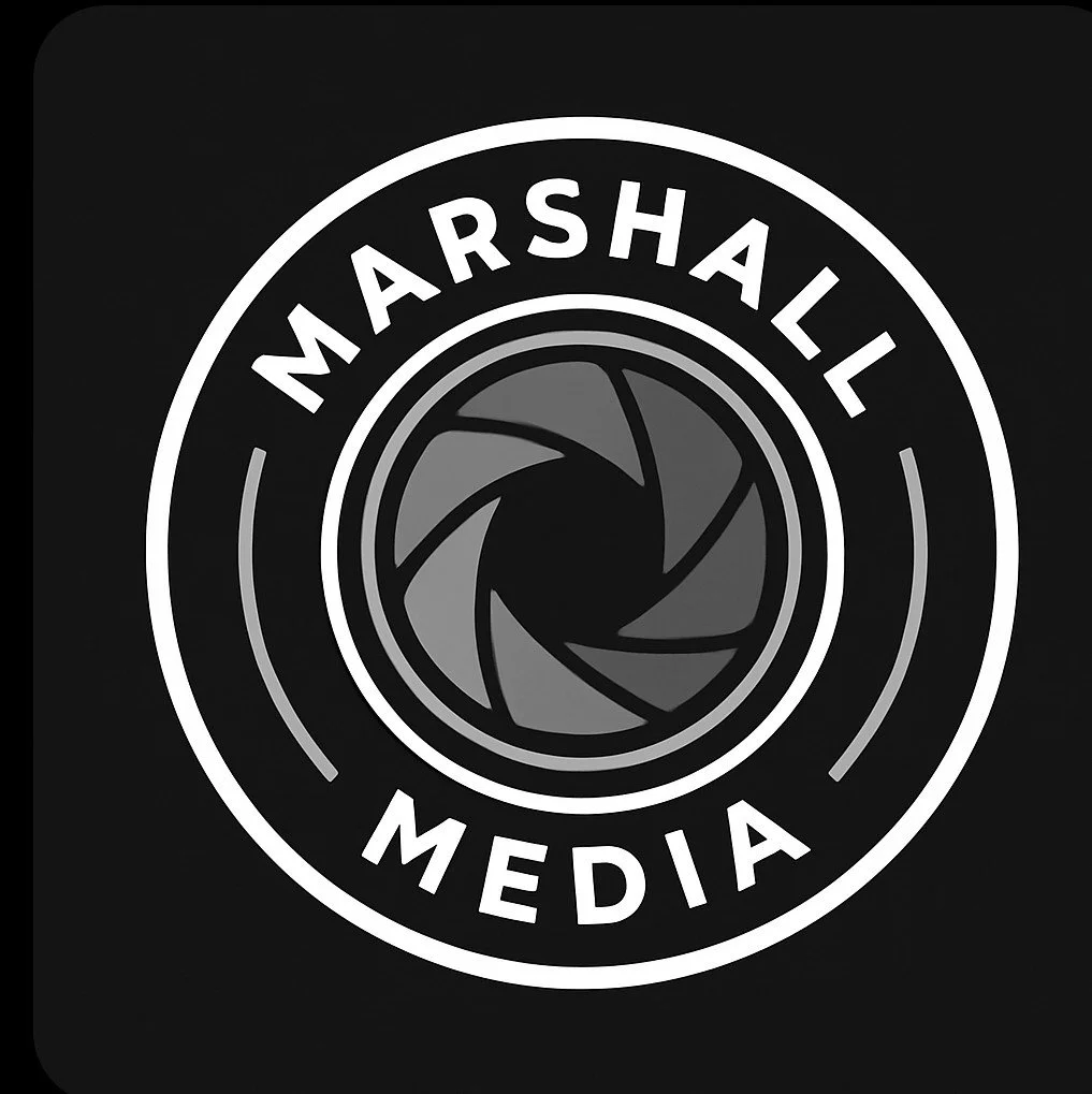 Black and white logo for Marshall Media with a camera shutter graphic in the center.