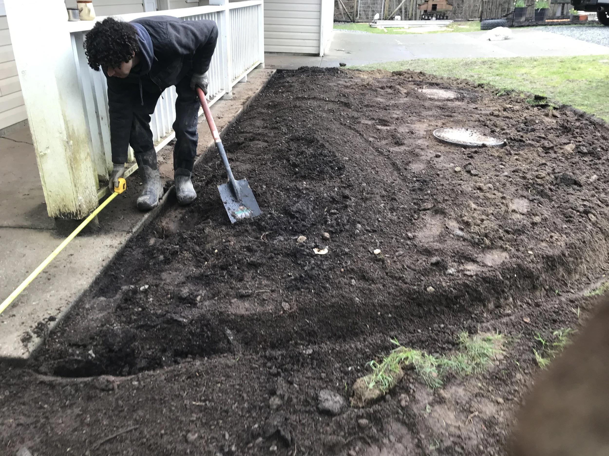 Luca preparing a new bed for Julia's front garden. April 2026